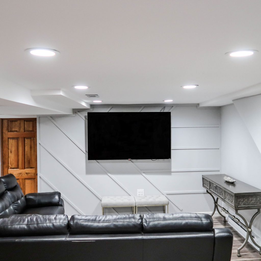 Finished basement media room with recessed lighting installed by RJS Electrical Contracting Corp.