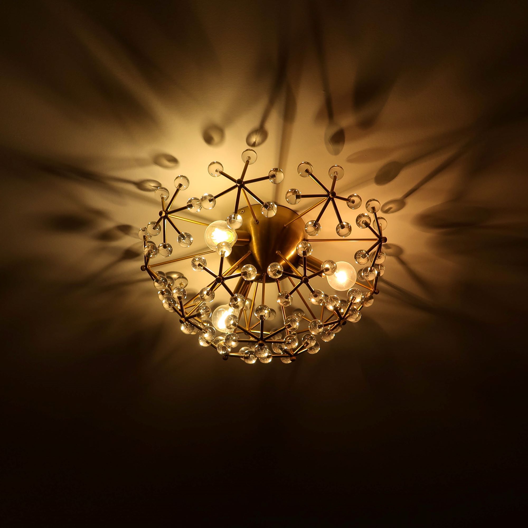 Designer brass chandelier installed by RJS Electrical Contracting Corp.